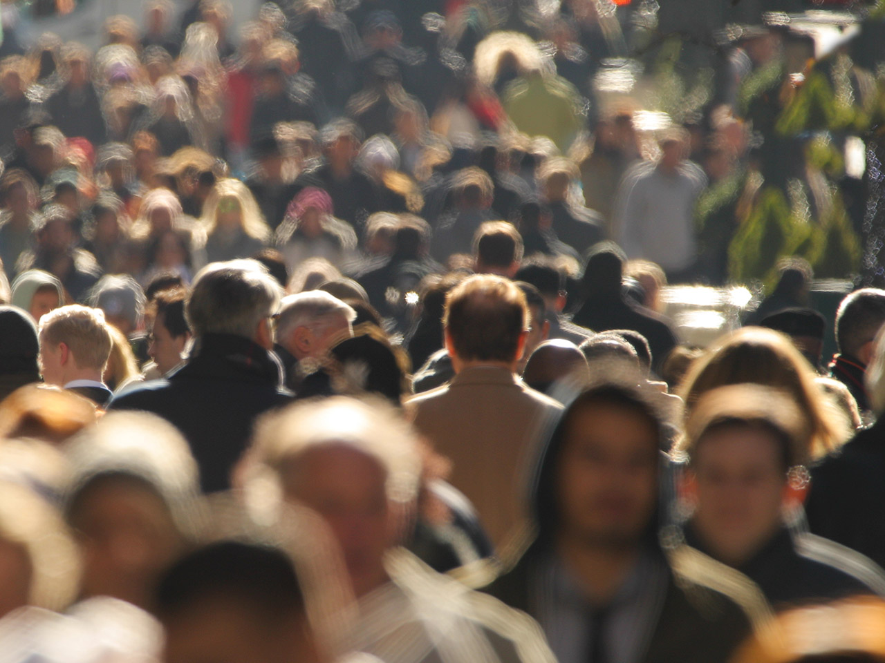 Crowd of people walking street